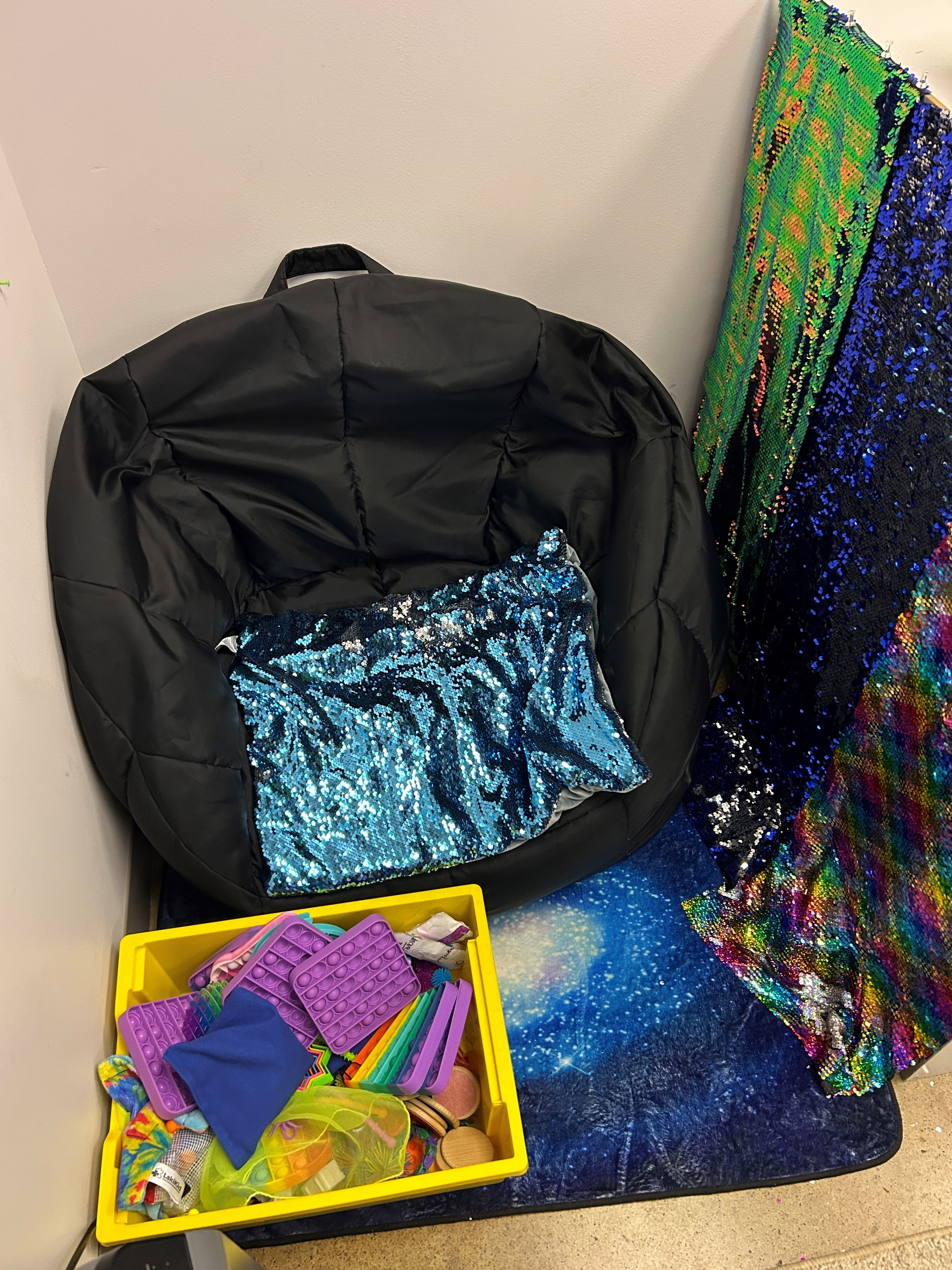 Bean bag chair and fidget toys set up in a classroom